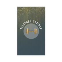 A personal trainer gold dumbbell on glitter