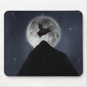 A pig flies across full moon over mountain peak mouse mat