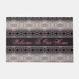 A Pink And Black Watercolor Patterned Doormat