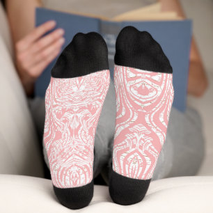 a pink and white abstract design on a white backgr socks