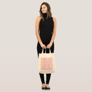 a pink and white abstract design on a white backgr tote bag
