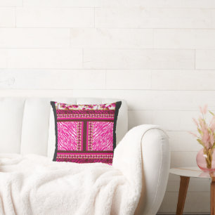 a pink and white wallpaper with a cross on it cushion