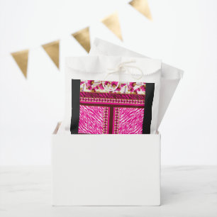 a pink and white wallpaper with a cross on it favour bags