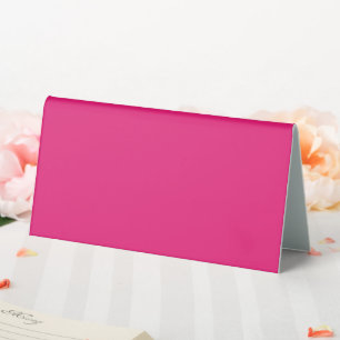 a pink background with a black border