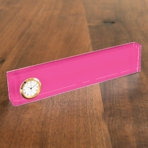 a pink background with a black border nameplate