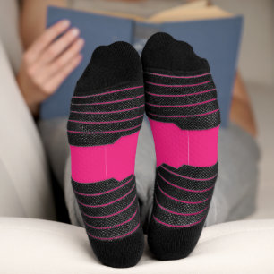 a pink background with a black border socks