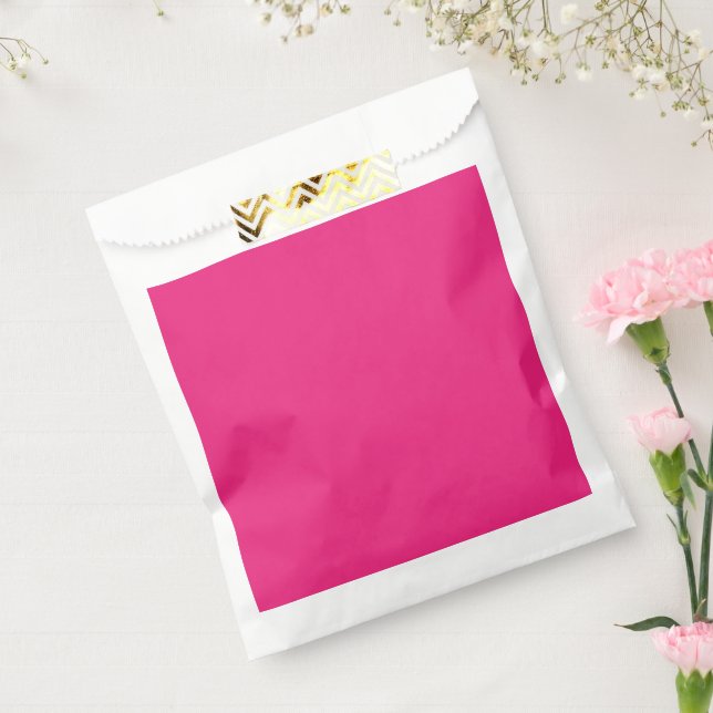 a pink background with a black favour bags (Sealed)