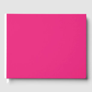 a pink background with a black guest book
