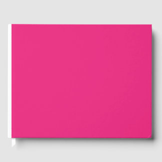 a pink background with a black guest book