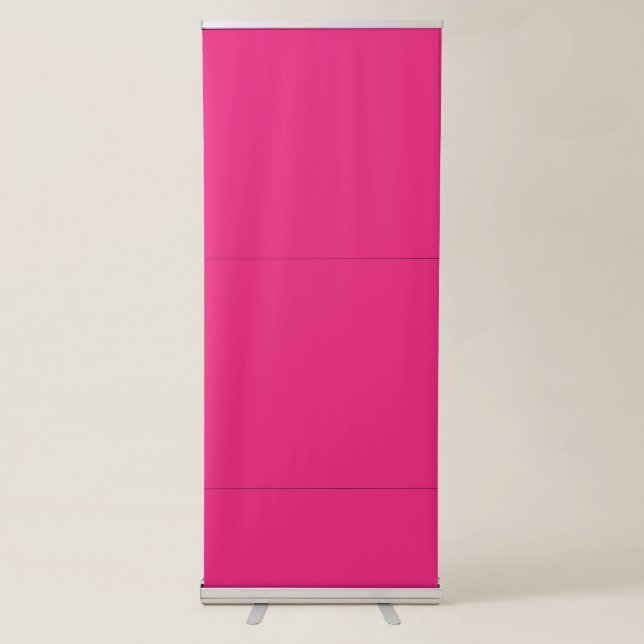a pink background with a black retractable banner (Front)