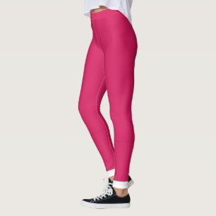 a pink background with a white border leggings