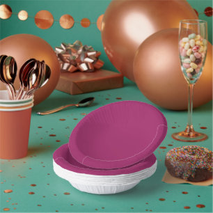 a pink background with a white border paper plate