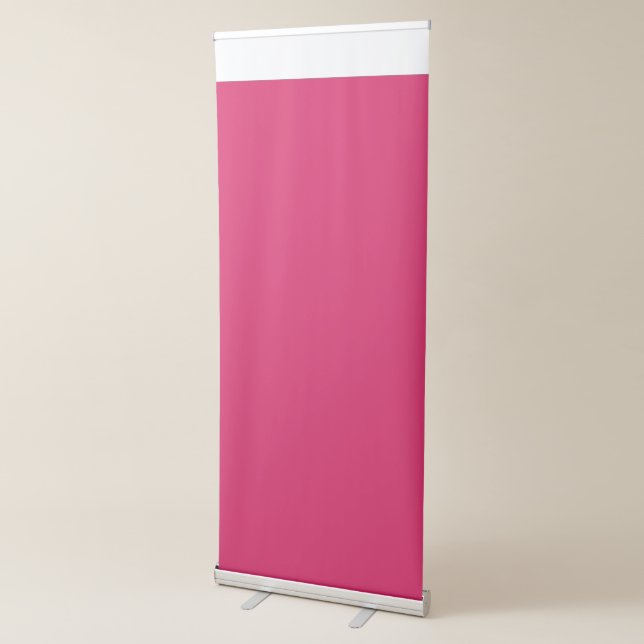 a pink background with a white border retractable banner (3/4)