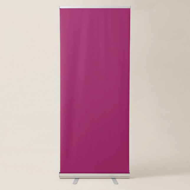 a pink background with a white border retractable banner (Front)