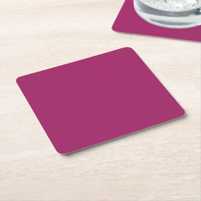 a pink background with a white border square paper coaster (Angled)