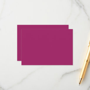 a pink background with a white enclosure card