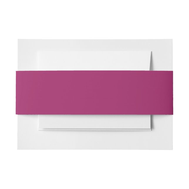 a pink background with a white invitation belly band (Front Example)