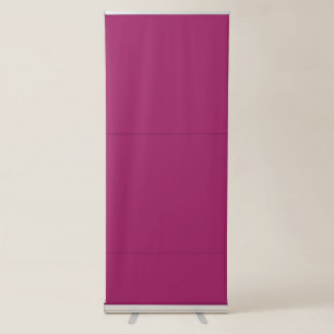 a pink background with a white retractable banner