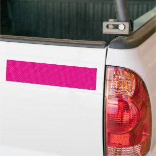 a pink background with white polka dots bumper sticker