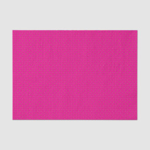 a pink background with white polka dots tissue paper