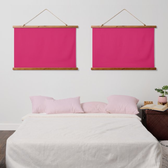 A pink square with a crisp white border, presentin hanging tapestry (Bedroom)