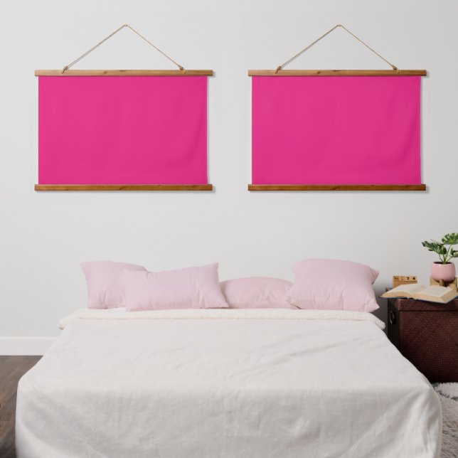 A pink square with a white border, creating a simp hanging tapestry (Bedroom)