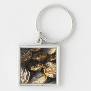 A plate of oysters. key ring