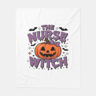 A playful design featuring a pumpkin witch with a fleece blanket