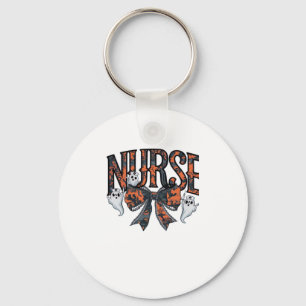 A playful design featuring a pumpkin witch with a  key ring