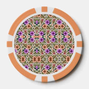 A poker chip with an intricate floral pattern