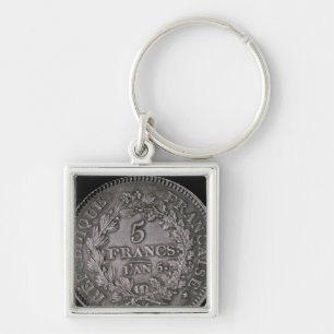 A pound of twenty sols key ring