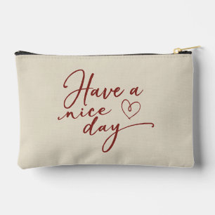 A product with a design of "Have a nice day" Accessory Pouch