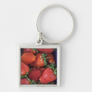 a punnet of ripe fresh strawberries for sale in key ring