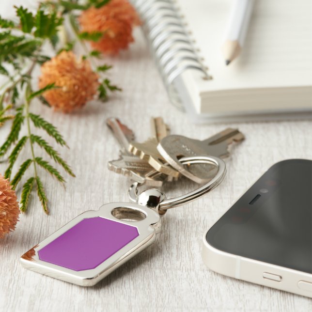 a purple background with a white border key ring (Side)