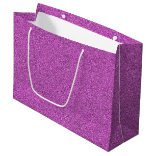 A purple glitter gift bag with white handles