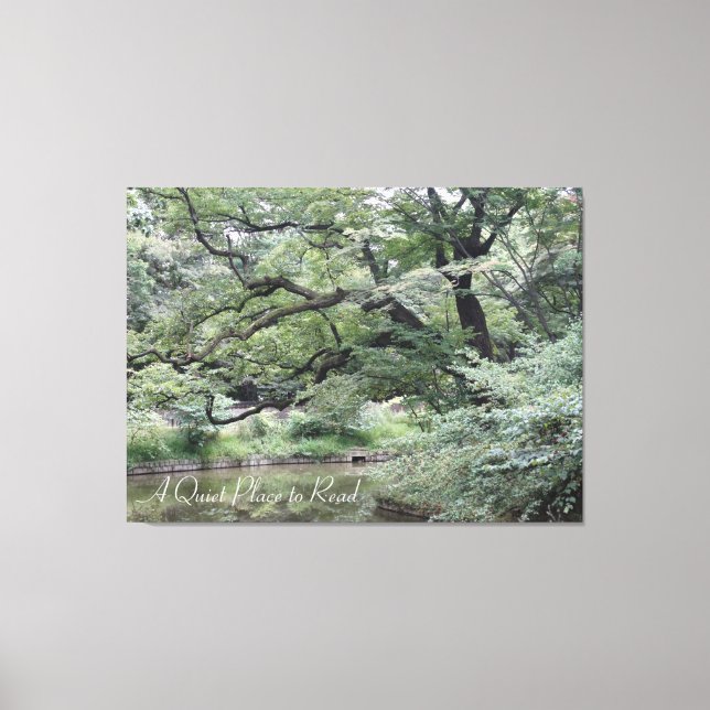 A Quiet Place to Read by water, under trees on a Canvas Print (Front)