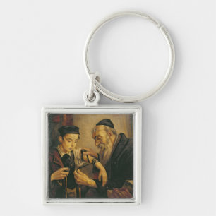 A Rabbi tying the Phylacteries to the arm of a boy Key Ring