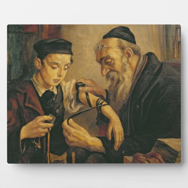 A Rabbi tying the Phylacteries to the arm of a boy Plaque (Front)