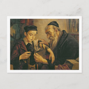 A Rabbi tying the Phylacteries to the arm of a boy Postcard