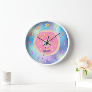 A rainbow of colours, a pink doughnut with a name  clock