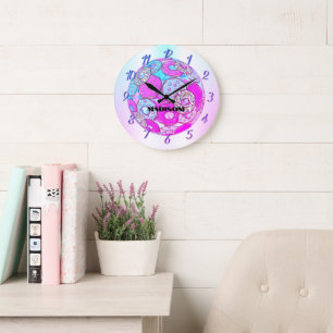 A rainbow of colours, a pink doughnut with a name large clock