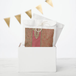 a red and beige rug with a gold border favour bags