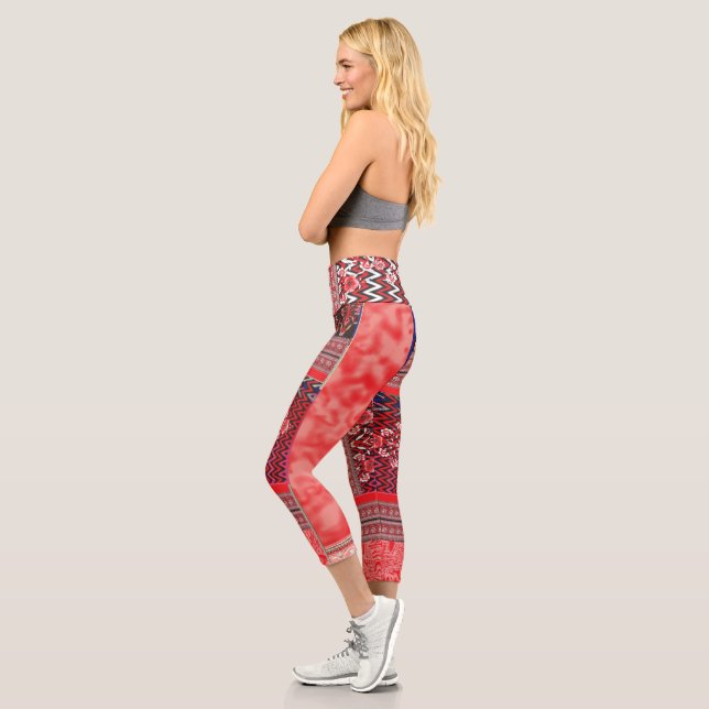 a red and black painting with a red heart on it capri leggings (Left)