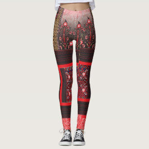 a red and black painting with a red heart on it leggings