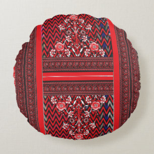 a red and black painting with a red heart on it round cushion