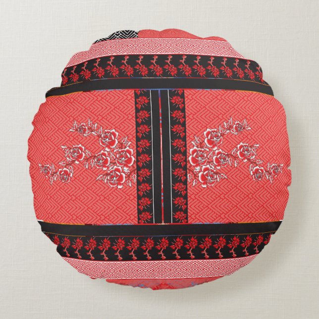 a red and black pattern with flowers on it round cushion (Front)