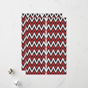 a red and black zigzag pattern on a white backgrou holiday card