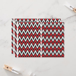 a red and black zigzag pattern on a white backgrou invitation