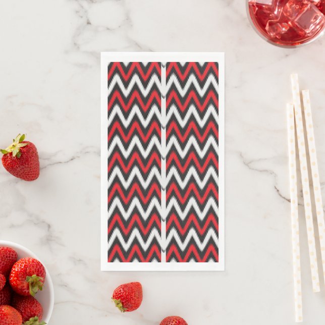 a red and black zigzag pattern on a white backgrou napkin (Insitu)
