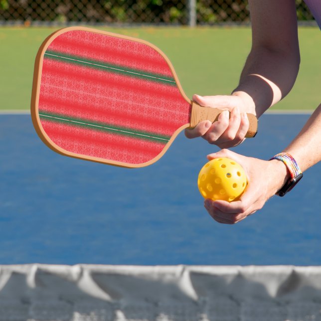 a red and green striped background pickleball paddle (Insitu)